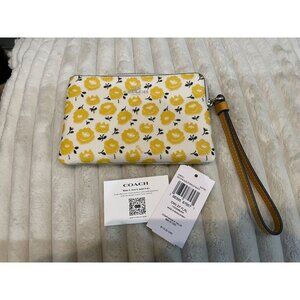 B312 - NWT Coach corner zip wristlet with floral print in chalk and buttercup mu